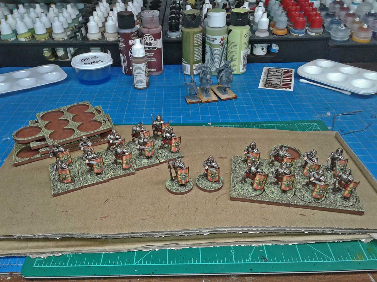 Painting and finishing Roman minis. Displayed on LITKO Movement Trays