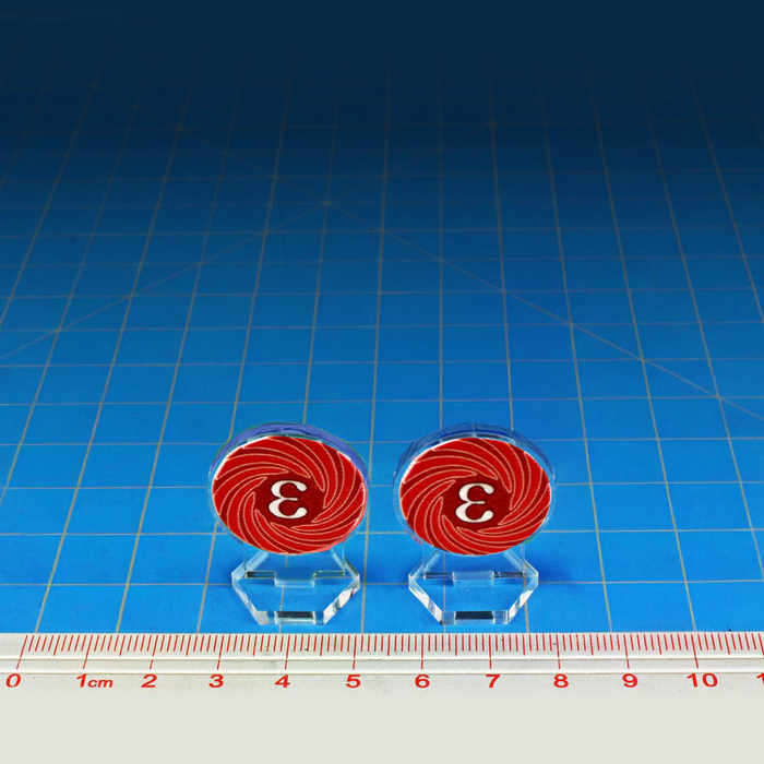 32mm crimson Epsilon wormhole markers on a metric ruler showing clear acrylic assembly and size.