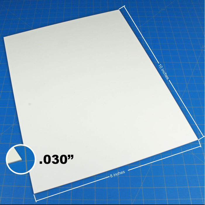 Close-up side view of a 0.030-inch thick styrene sheet demonstrating the thin profile used for fine model detailing.
