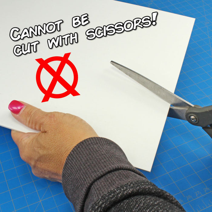 Product graphic of a hand attempting to cut a thick 0.100-inch white styrene sheet with scissors, featuring a red "no" symbol and text stating it cannot be cut with scissors.